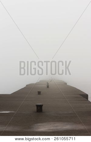 A Pier On Lake Michigan Obscured By Thick Fog.  Sheboygan, Wisconsin, Usa.