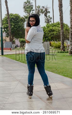 Very Beautiful Chubby Woman With Glasses Happy With Her Inline Skates