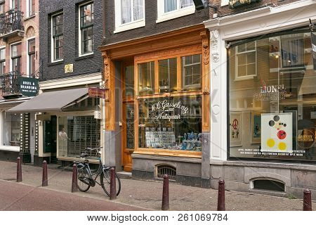 Amsterdam, Netherlands - June 25, 2017: View Of The M.c. Gasseling Antiquair Shop On The Nieuwe Spie