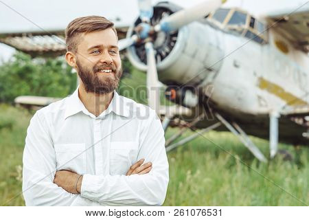 The Man In The Shirt Stands At The Old Plane