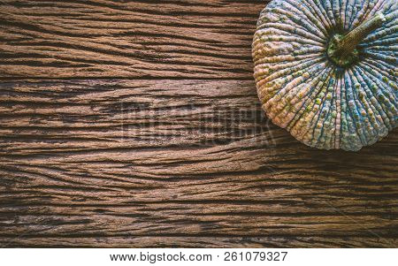 Top View Of Raw Pumpkin On Gruge Wooden Background. Fresh Organic Vegetable, Top View With Copy Spac
