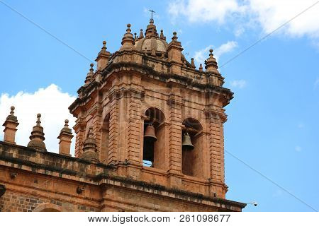 The Belfry Of Iglesia De La Compania De Jesus Church Against Bright Blue Sky Of Cusco, Peru, South A