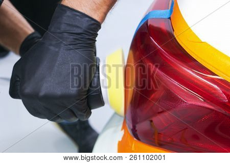 Car Polish Wax Worker Hands Holding Polisher And Polish. Close Up At Hand Holding Car Polisher. Man 