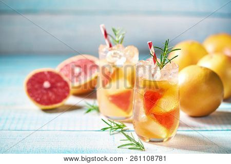 Ripened Grapefruit And Fresh Rosemary To Prepare A Refreshing Su
