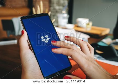 Chiang Mai, Thailand - Sep 09,2018: Woman Hands Holding Oneplus6 Mobile With Dropbox On The Screen. 