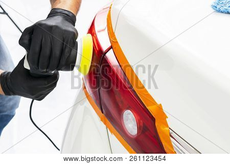 Car Polish Wax Worker Hands Holding Polisher And Polish. Close Up At Hand Holding Car Polisher. Man 
