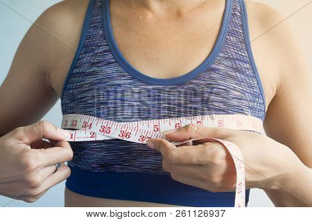 Asian Woman Measuring Breasts, Cancer Or Surgery Concept