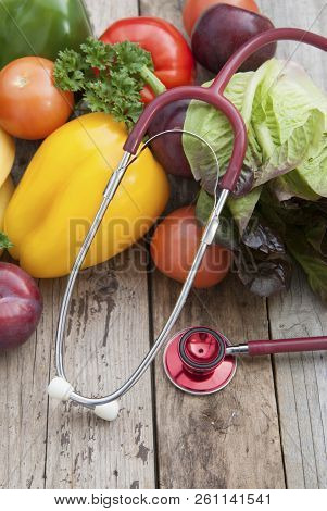 Sthetoscope And Fresh Colorful Vegetables Ingredients Fo Vegan And Healthy Cooking Or Salad Making O