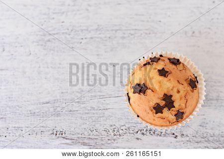 Sweet Delicious Homemade Vanilla Muffins Whit Chocolate Chips At White Wooden Background