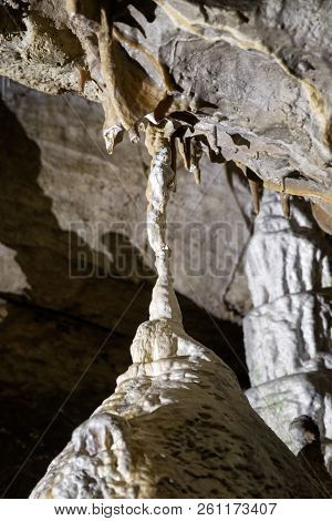 Small Stalagnat In The Cave. Close Up View