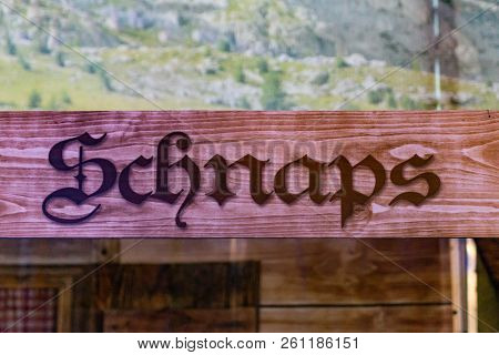 Wooden Signs From A Bar At The German Oktoberfest Referring To Shots-schnaps Area Where People Can B