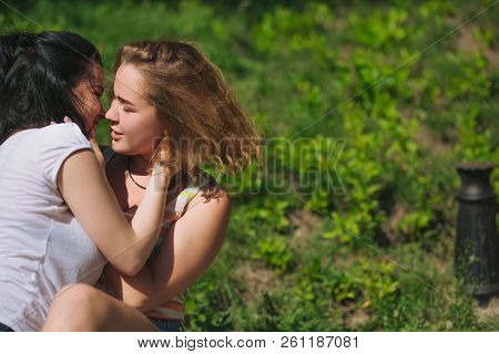 Two Best Frinds Have Fun In The Park. Two Girl Almost Kiss Each Other.