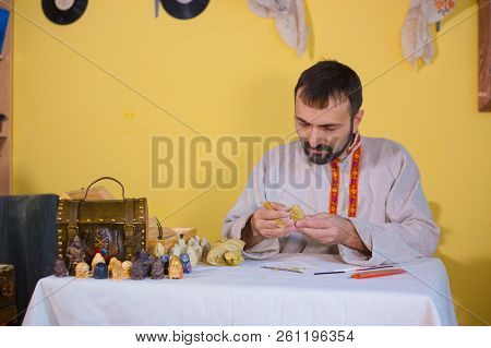 Potter Making Clay Figure For Board Game