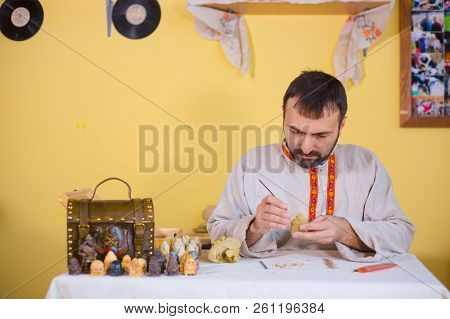 Potter Making Clay Figure For Board Game