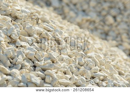 Breakstone background. Road gravel. Gravel texture. Crushed Gravel background. Piles of limestone ro