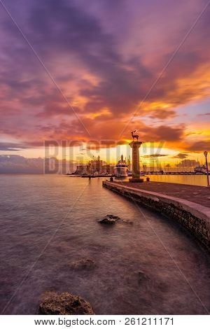Agios Nikolaos fortress on the Mandraki harbour of Rhodes Greece at dusk