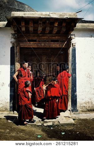 Labrang Monastery, Xiahe, Gansu Province / China - Jun 6 2011: Young Tibetan Buddhist Monks Waiting 