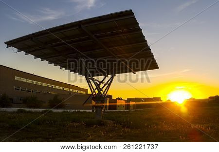 Urban Photovoltaic Panel With Solar Tracker Placed Outdoors Building
