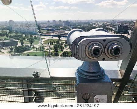Monetary Stationary Binoculars On The Background Of Sky. Gray Metal Binoculars On The Viewing Platfo