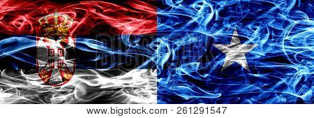 Serbia Vs Somalia, Somalian Smoke Flags Placed Side By Side. Thick Colored Silky Smoke Flags Of Serb