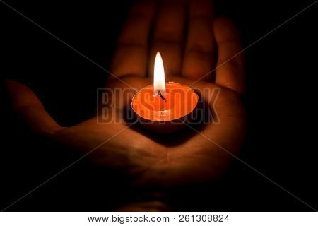 Burning Candle On The Palm, Close Up