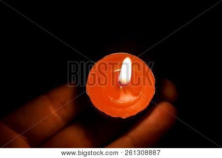 Burning Candle On The Palm, Close Up
