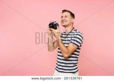Portrait Of Smiling Young Photographer Man Wearing Striped T-shirt Take Pictures On Retro Vintage Ph