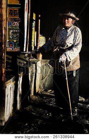 Labrang Monastery, Xiahe, Gansu Province / China - Jun 6 2011: Tibetan Pilgrim Woman Walking Around 