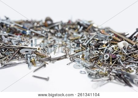 A Lot Of Cogs, Screws, Bolts And Moods On A White Background.