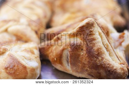 Close Up Freshly Baked Puff Pasty From The Oven In Bakery Shop