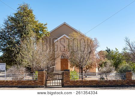 De Aar, South Africa, August 6, 2018: A Street Scene, With The Dutch Reformed Mother Church Hall, In