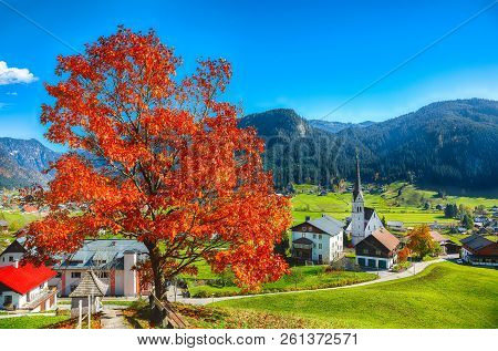 Alpine Green Fields And Traditional Wooden Houses View Of The Gosau Village At Autumn Sunny Day. Loc