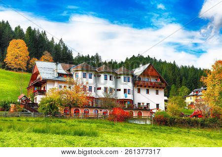 Alpine Green Fields And Traditional Wooden Houses View Of The Gosau Village At Autumn Sunny Day. Loc