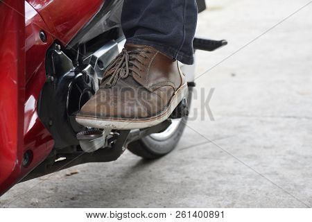 Shift Into First Gear And Upshift Into Higher Gears. On A Motorcycle.