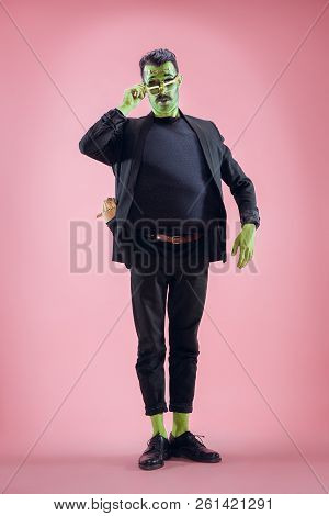 Bloody Halloween Theme: The Crazy Maniak Face On Pink Studio Background