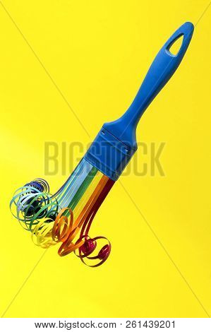 Brush With Swirling Rainbow Strips For Quilling. Artificial Object That Mimics Natural Shapes. Yello