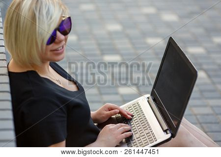 Woman Plus Size Walking Outdoors With Laptop In Sunglasses. Freelancer Works, Looking For A Client I