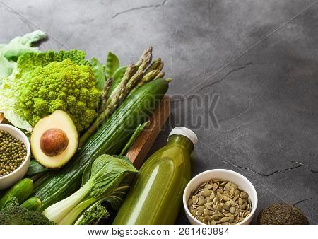 Assorted Green Toned Raw Organic Vegetables On Dark Background. Avocado, Cauliflower And Cucumber Wi