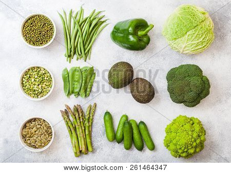 Assorted Green Toned Raw Organic Vegetables On White Background. Avocado, Cabbage, Broccoli, Caulifl