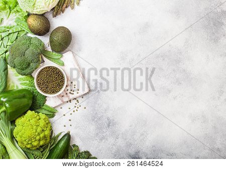 Assorted Green Toned Raw Organic Vegetables On White Background. Avocado, Cabbage, Broccoli, Caulifl