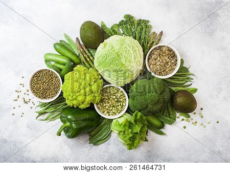 Assorted Green Toned Raw Organic Vegetables On White Background. Avocado, Cabbage, Broccoli, Caulifl