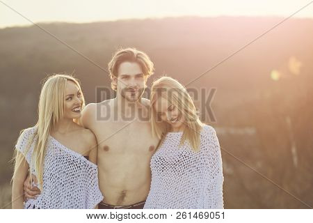 Beauty And Fashion. Blonde And Guy With Athletic Chest. Girl And Women With Boyfriend Outdoor. Man W