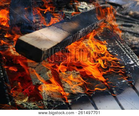 Painted Waste Wood Burning With Hot Flame