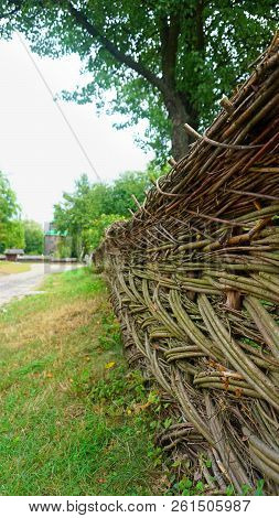 Old Ancient Ukrainian Wicker By Hands Fence In The Village