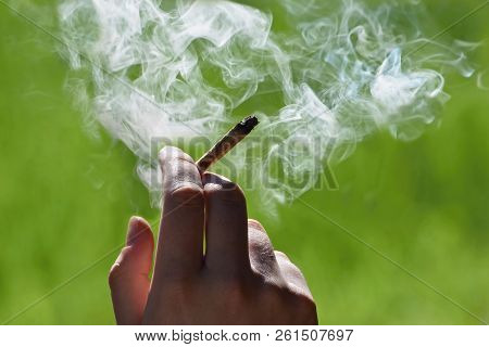 Marijuana Joint In The Hand, Drugs Concept