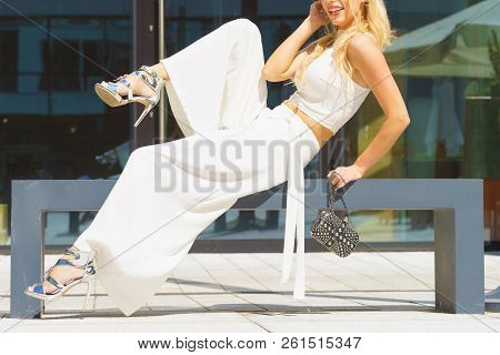 Elegant Fashionable Woman Presenting Trendy Urban Outfit. White Crop Top And Trousers Culottes. Outd