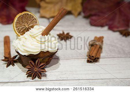 Pumpkin Spice Muffin Frosted With Mascarpone Chesee And Cream, Whipped 
Icing, Decorated With Cinnam