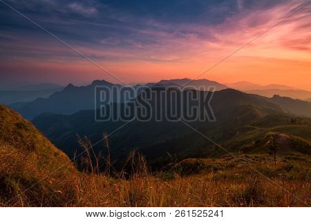 Sunset Scene With The Peak Of Mountain And Cloudscape At Phu Chi Fa In Chiang Rai,thailand