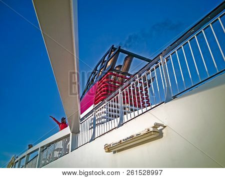 Chimney Of The  Cruise Lainer In Baltic Sea With. The Ferry  Is Moored At The Mooring In The City Of