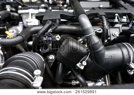 Close Up Of The Powerful Car Engine. Internal Design Of Engine. Automobile Metal New Car Engine Part
